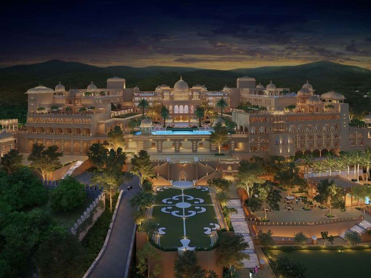 Aerial night view of Fairmont Udaipur Palace, a luxury destination wedding venue in Udaipur with illuminated palace architecture and landscaped gardens.