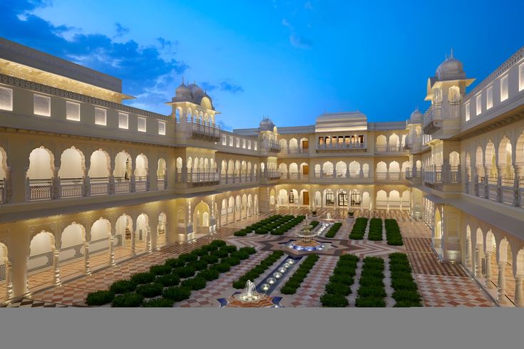 Grand heritage palace courtyard with fountains and arches for a luxury destination wedding in Jaipur